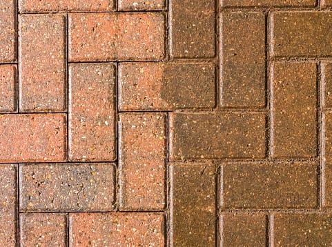Block paving with half jet washed and half still dirty